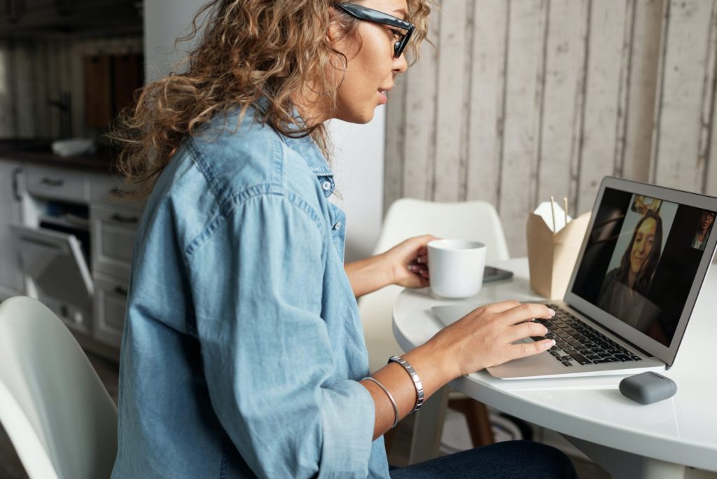 Woman having a conversation during a video conference.