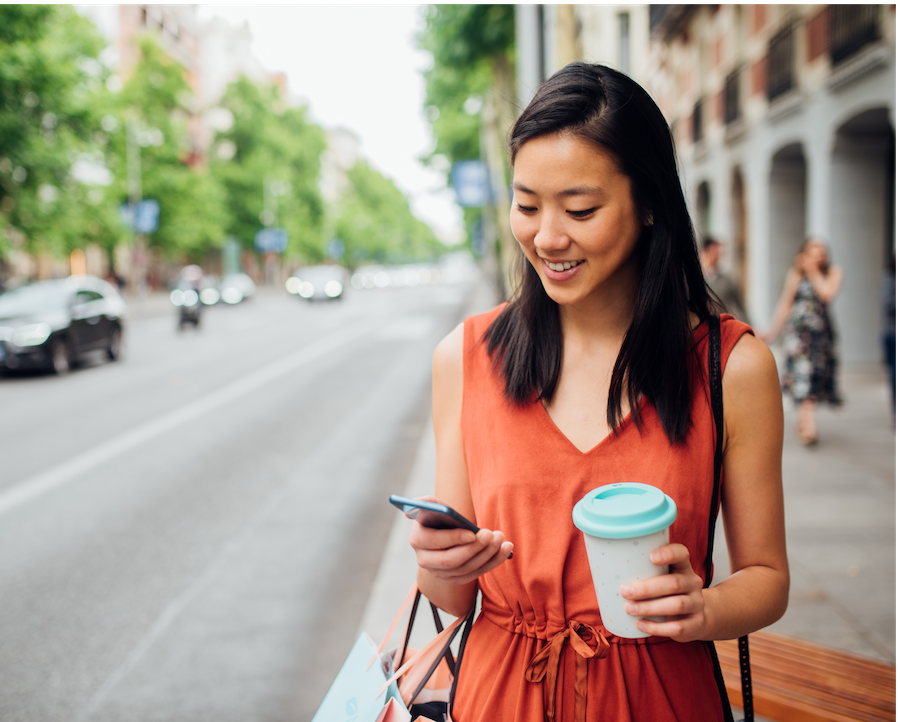 girl shopping and looking at her phone