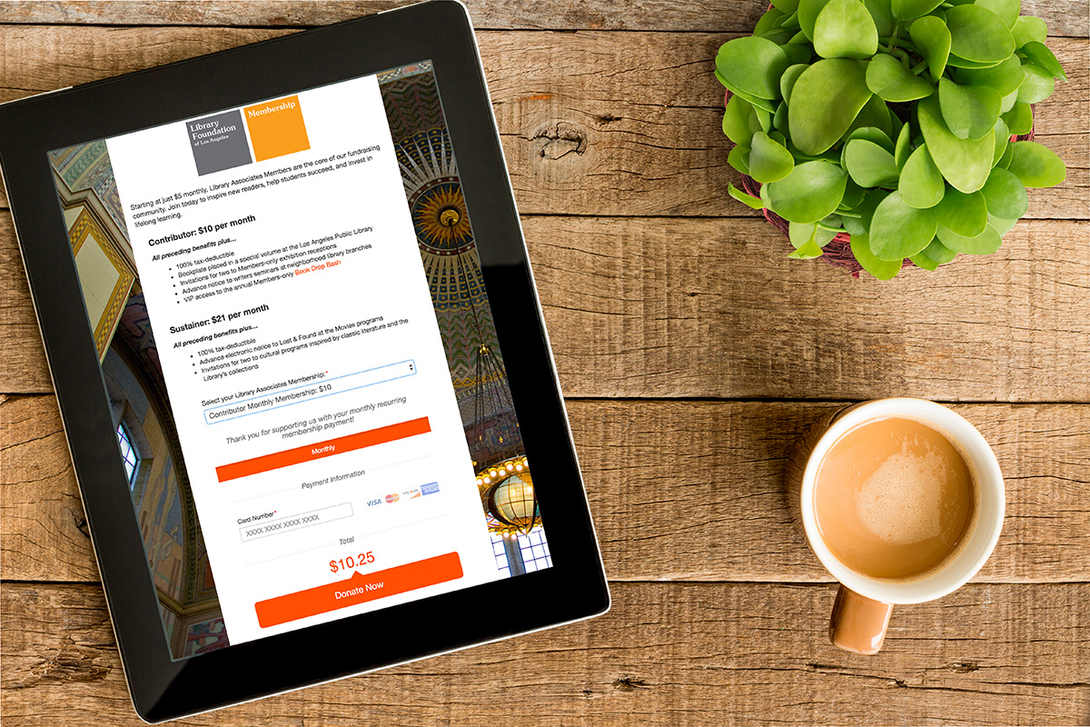 Membership_Model_Infographic_Image-1200x800-1 Digital Tablet on a table next to a coffee mug and plant